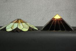 Two Tiffany style stained glass lamp shades, one of pyramid form, the other more foliate. H.17 Dia.