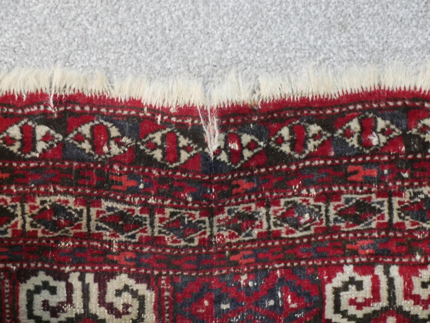 A red ground handmade Persian Turkman rug. L.115 W.100cm - Image 6 of 7