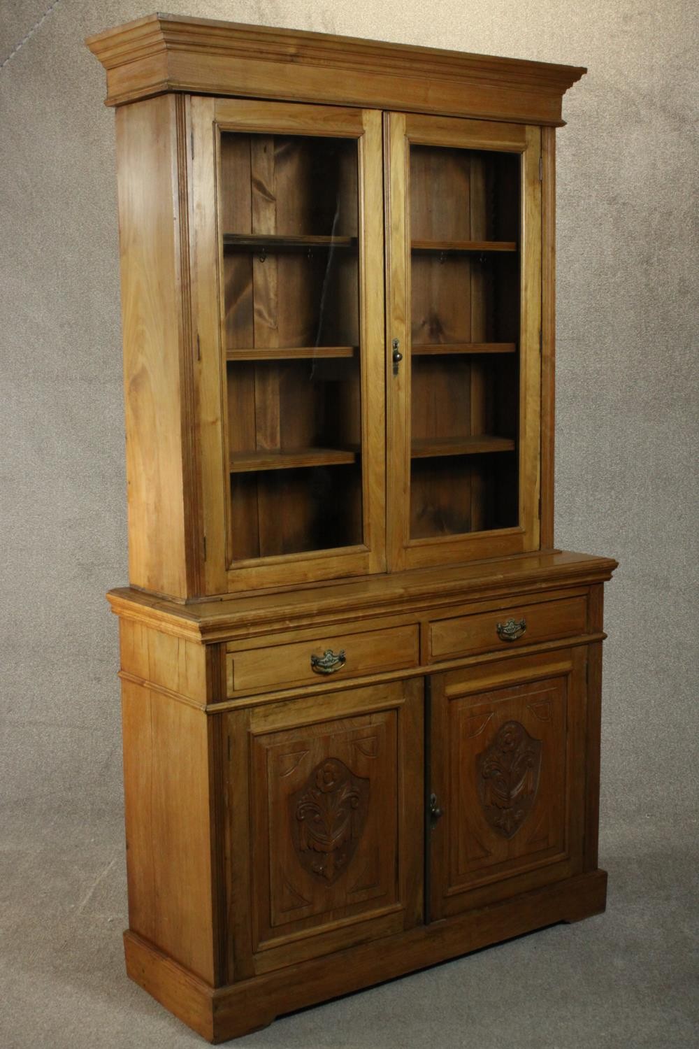 A Victorian style walnut bookcase, the two glazed doors enclosing shelves, over two short drawers - Image 8 of 11