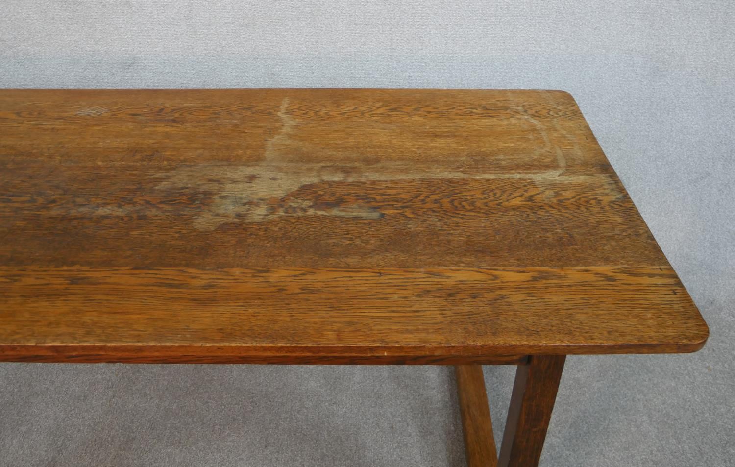 A Heals style Arts and Crafts oak refectory dining table on square trestle supports resting on - Image 2 of 5