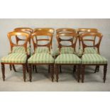 A harlequin set of eight Victorian walnut dining chairs, comprising a set of six side chairs and a