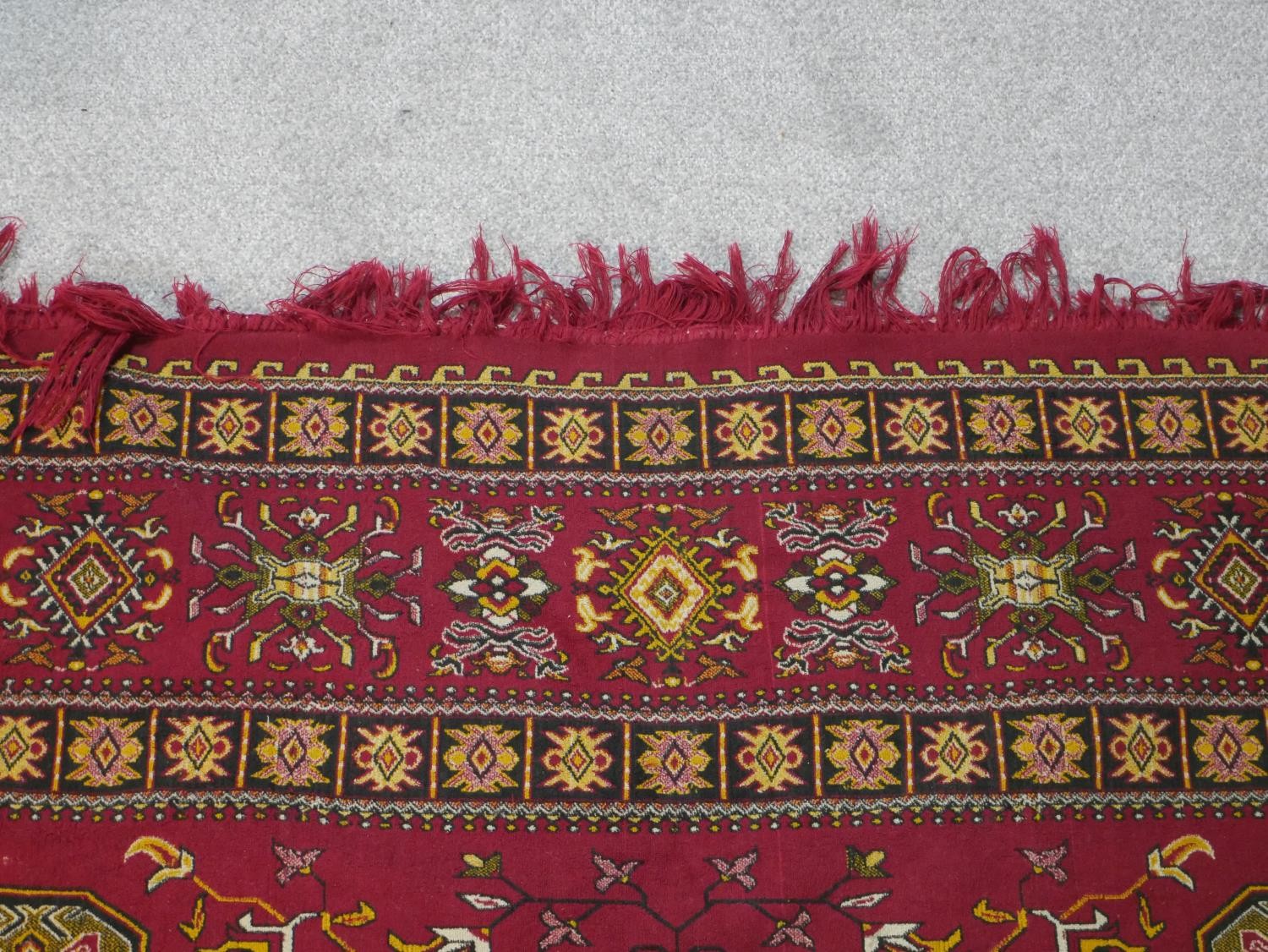 A red ground Heriz motif carpet. L.300 W.196cm - Image 4 of 5