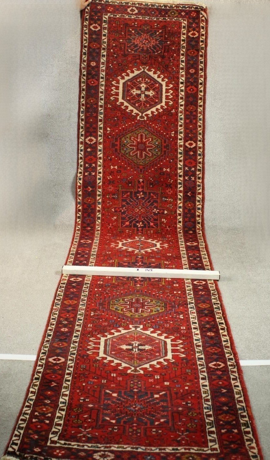 A hand made red ground Persian Heriz runner. L.440 W.100cm. - Image 2 of 5