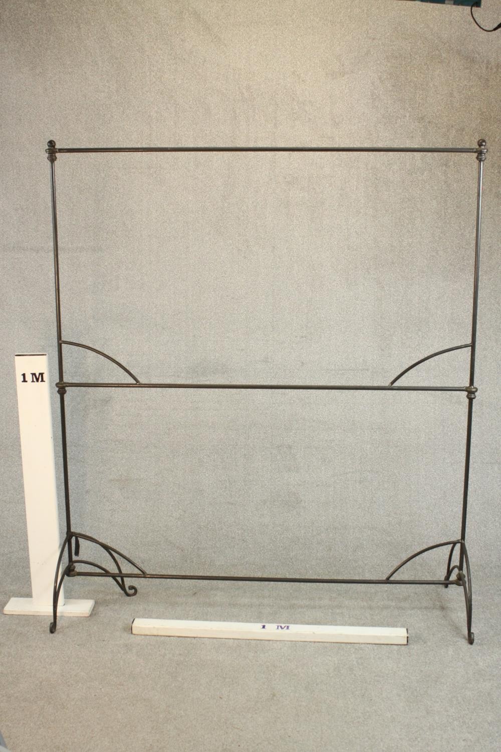 A two tier wrought iron clothes or drying rack. on scrolling legs. (One leg bent) H.176 W.152 D. - Image 2 of 5