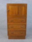 A 1930's Heals style oak tallboy cabinet by Ebenezer Gomme with maker's label to the back. H.100 W.