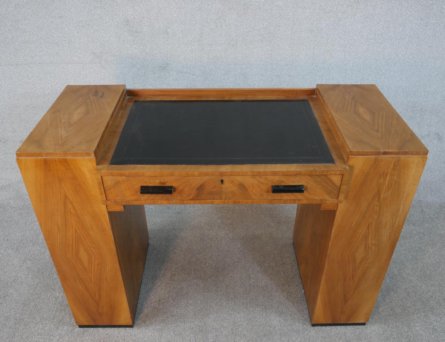 An Art Deco quarter veneered walnut desk with open bookshelves to each pedestal by Maple and Co. H. - Image 2 of 6