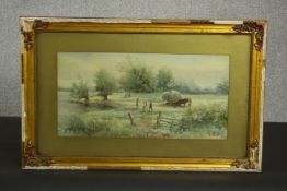 A gilt framed 19th century watercolour of a river landscape with farm workers and horse and haycart,