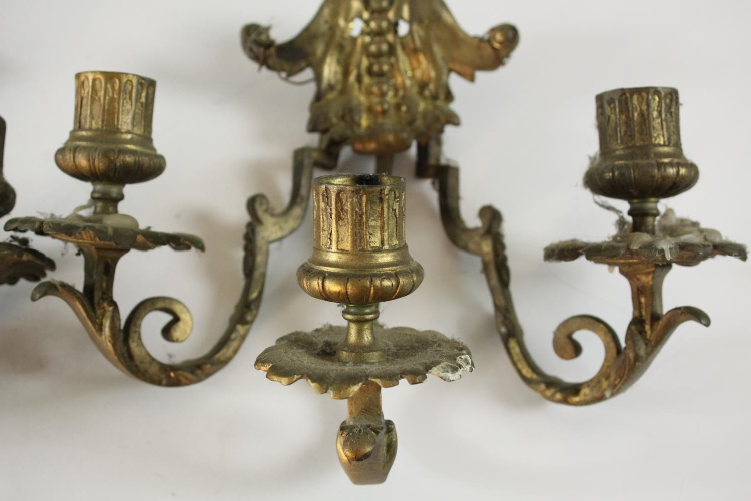 A pair of gilt brass three branch wall scones with stylised foliate design. H.20 W.26 D.18cm. (each) - Image 3 of 5