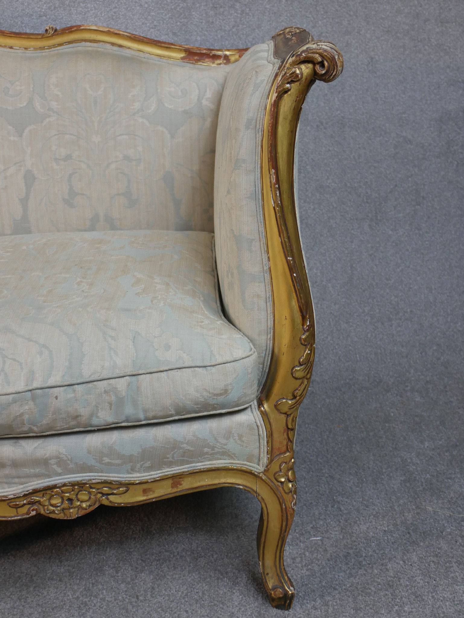 A carved giltwood Louis XV style sofa in floral upholstery on cabriole supports. H.102 W.208 D.76cm - Image 6 of 8