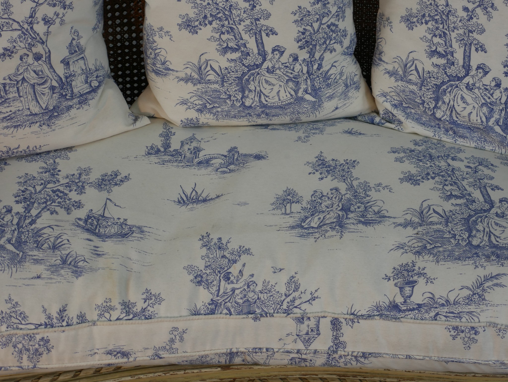 A French Louis XVI style painted canape sofa, with double caned back and sides, and loose cushions - Image 3 of 7