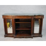 A William IV walnut breakfront sideboard, with a green marble top supported by four columns, with