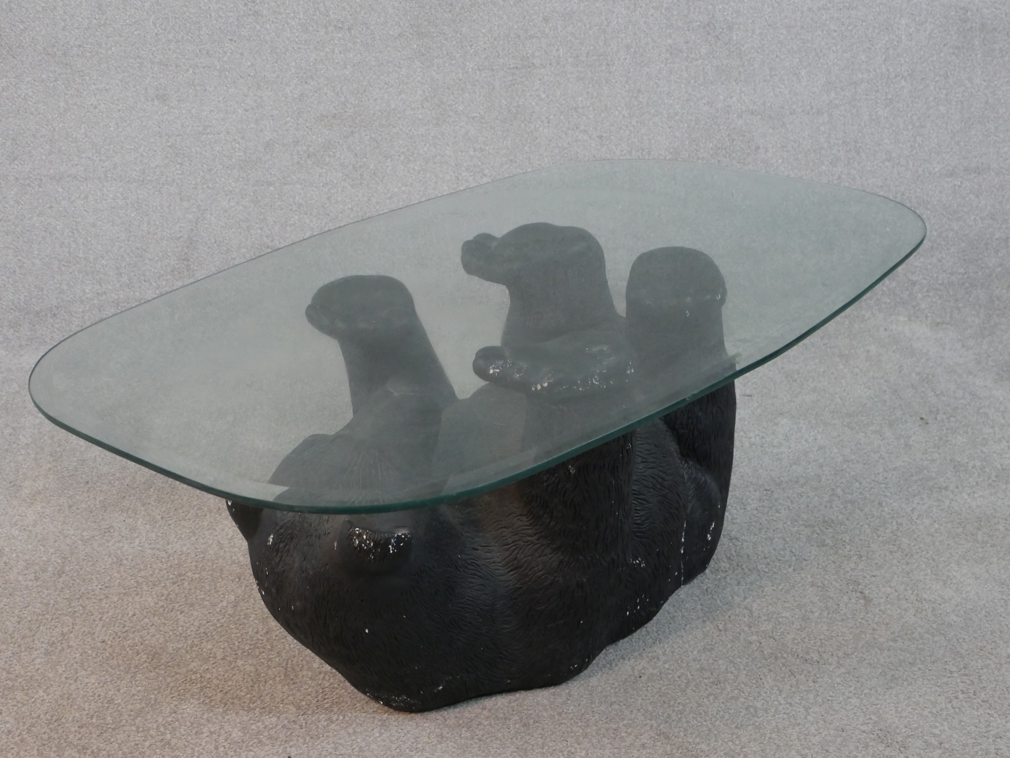 A contemporary glass topped coffee table supported by a moulded and painted bear. H.41 W.105 D. - Image 4 of 4