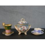 A collection of hand painted 19th century porcelain, including a French scroll handle gilded musical