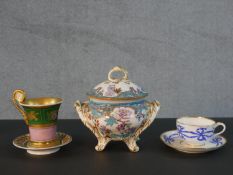 A collection of hand painted 19th century porcelain, including a French scroll handle gilded musical