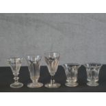 A collection of five Georgian glasses with petal faceting. H.12 Diam. 6cm (largest)
