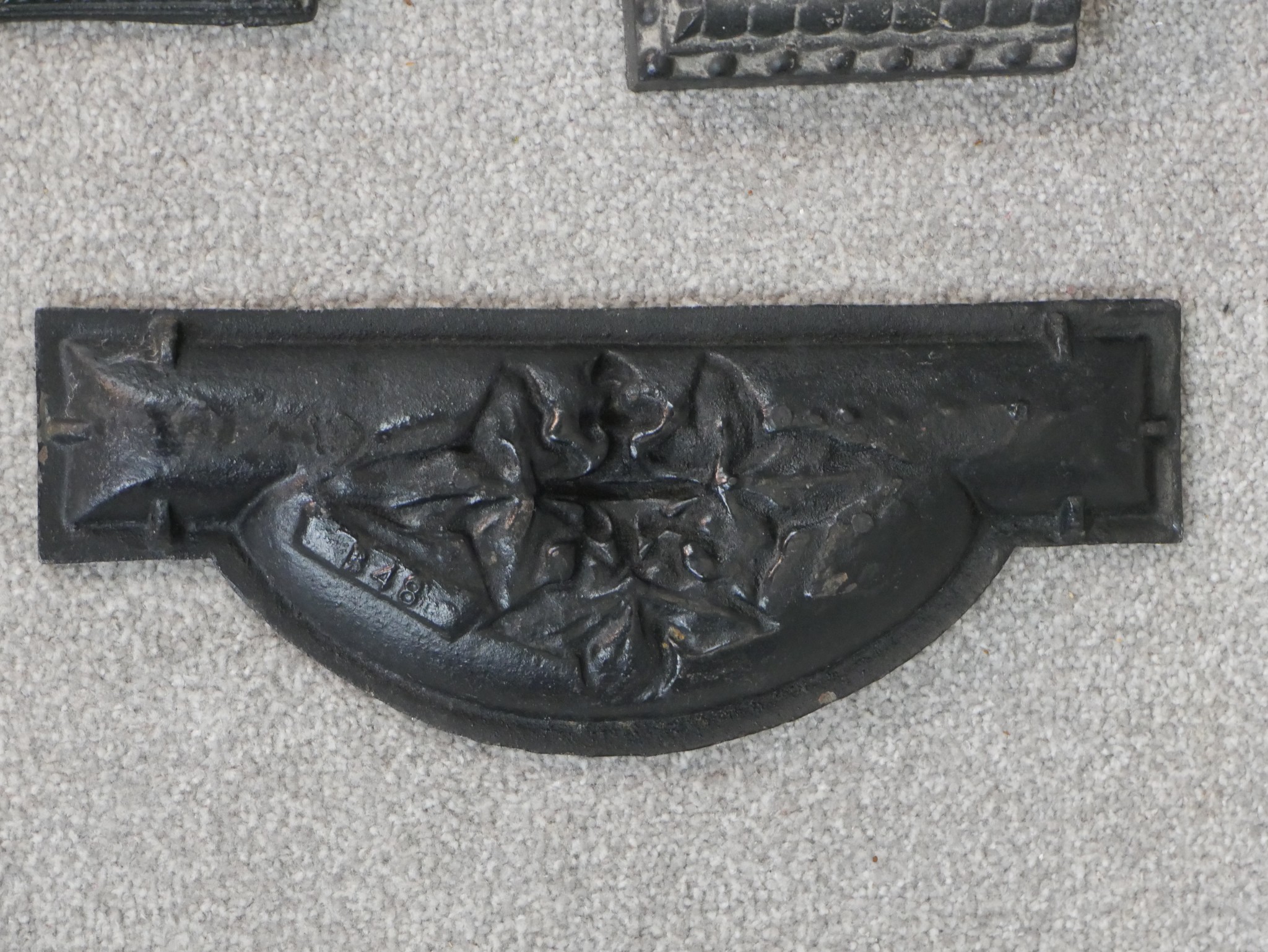 A Victorian black painted cast iron umbrella stand, in four parts, the back cast with a cherub - Image 6 of 6