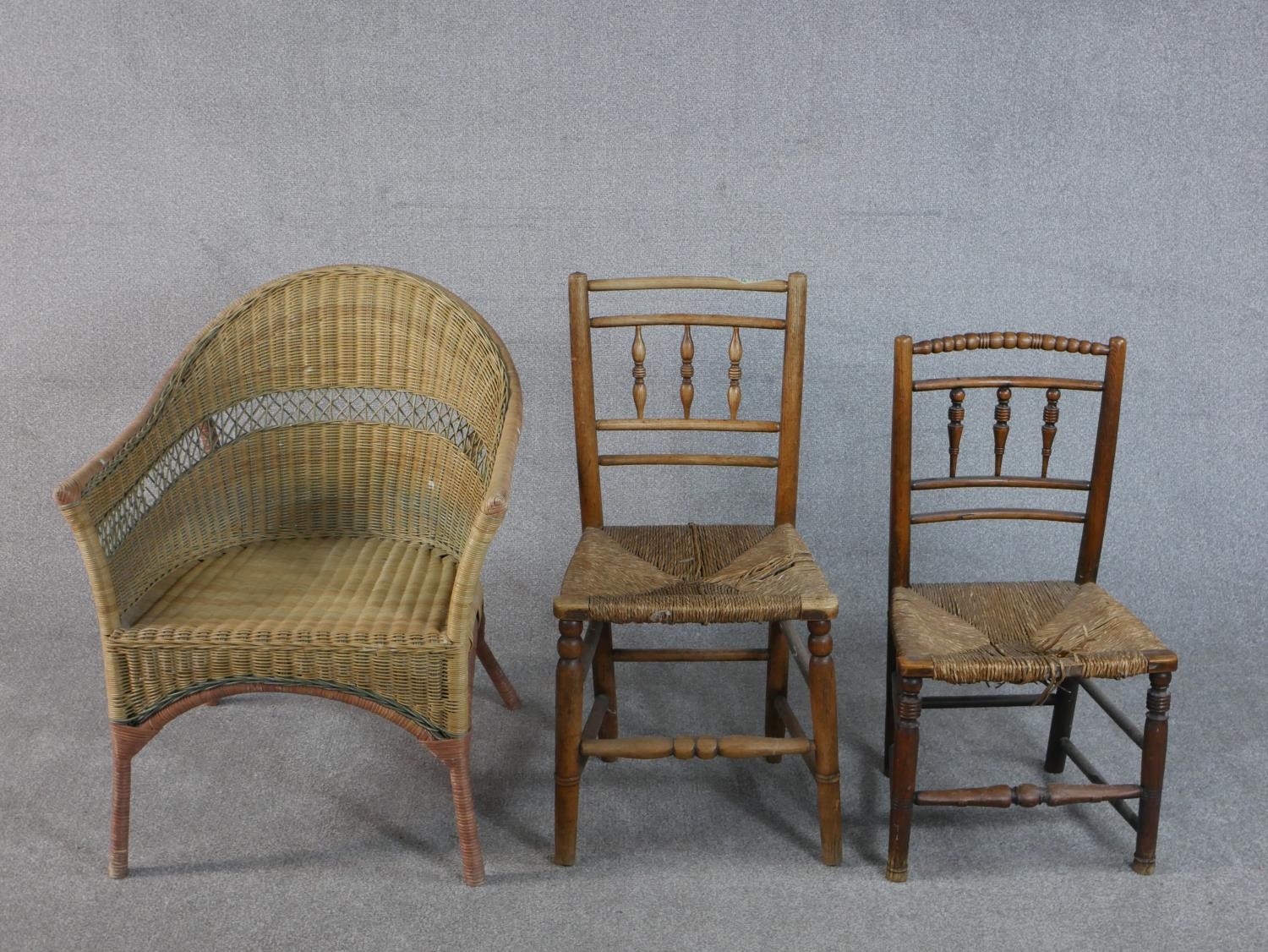 A Lloyd Loom wicker tub chair, together with two 19th century turned country side chairs with