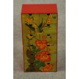 A contemporary painted chest of six rows of two short drawers, painted in the Chinese style with a