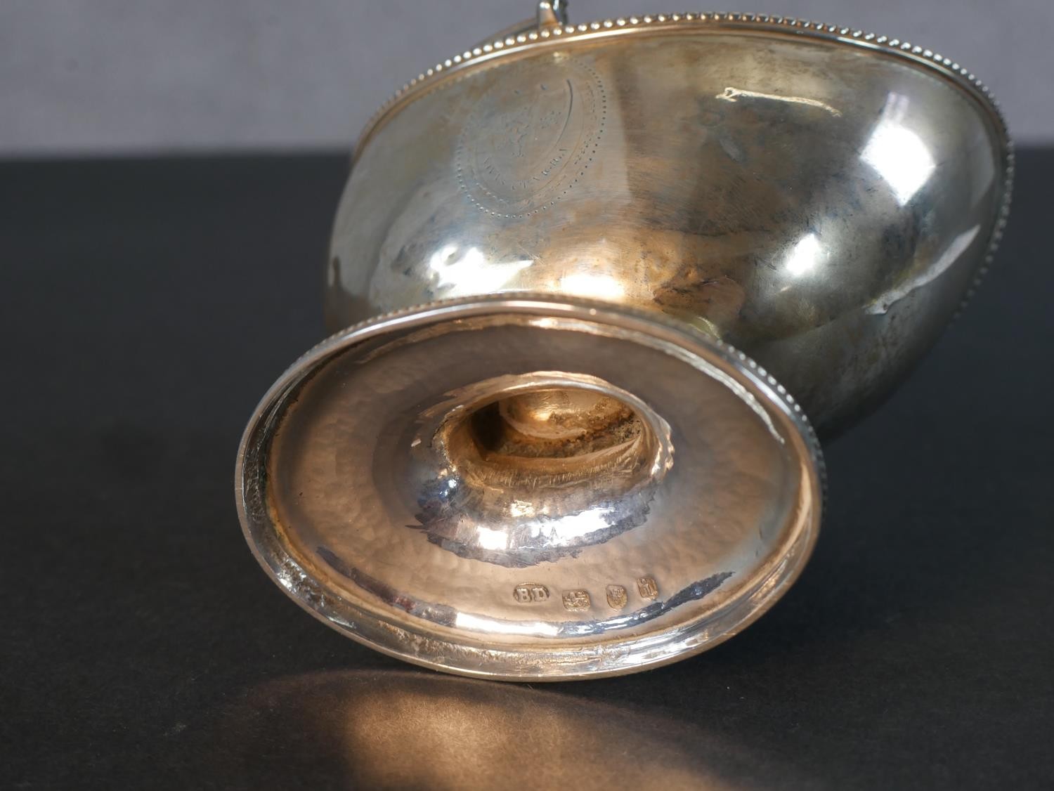 A Georgian sterling silver boat shaped sugar basket with handle and engraved cartouche along with - Image 6 of 6