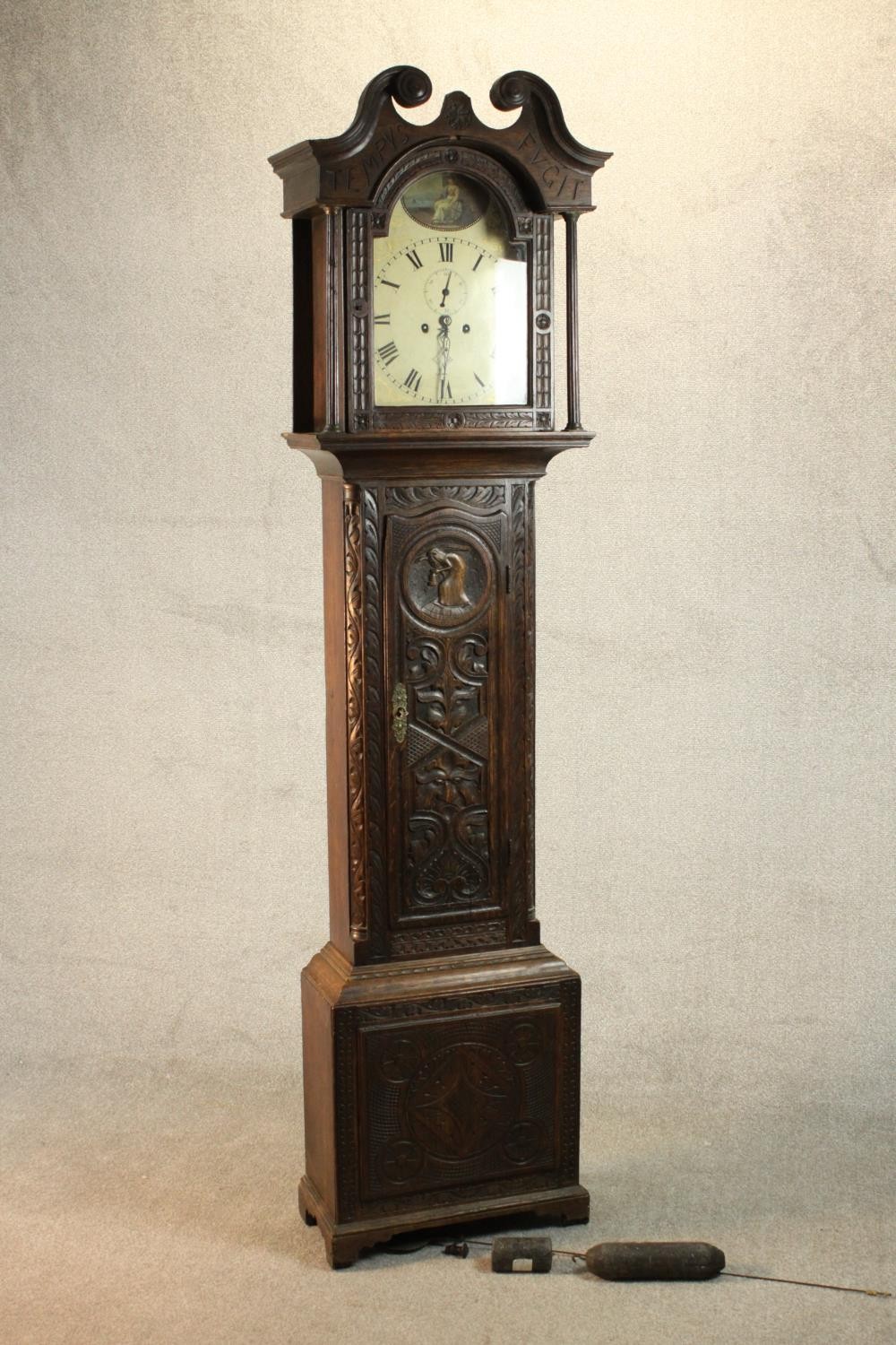 A 19th century carved oak longcase clock, the hood with a swan neck pediment and reeded columns, the - Image 2 of 13