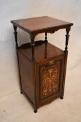 An Edwardian rosewood converted coal purdonium, the square top on turned columns, the marquetry