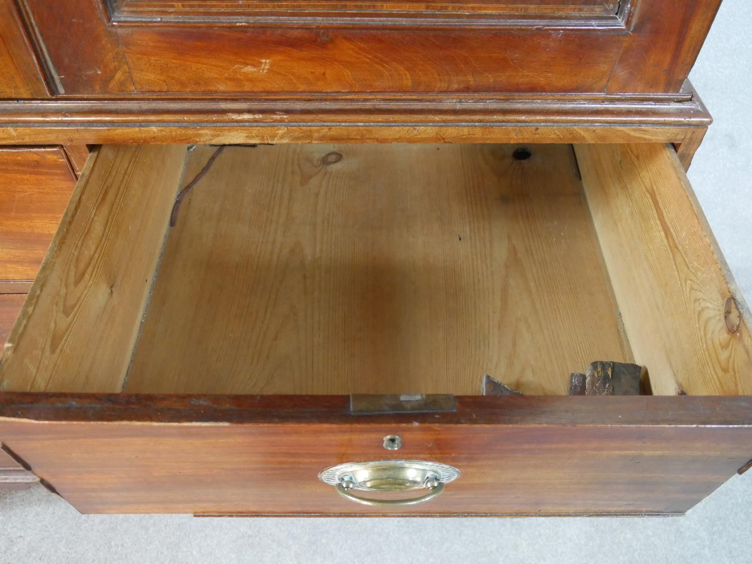 A Georgian mahogany press cupboard the upper section with flame mahogany panel doors enclosing - Image 4 of 7