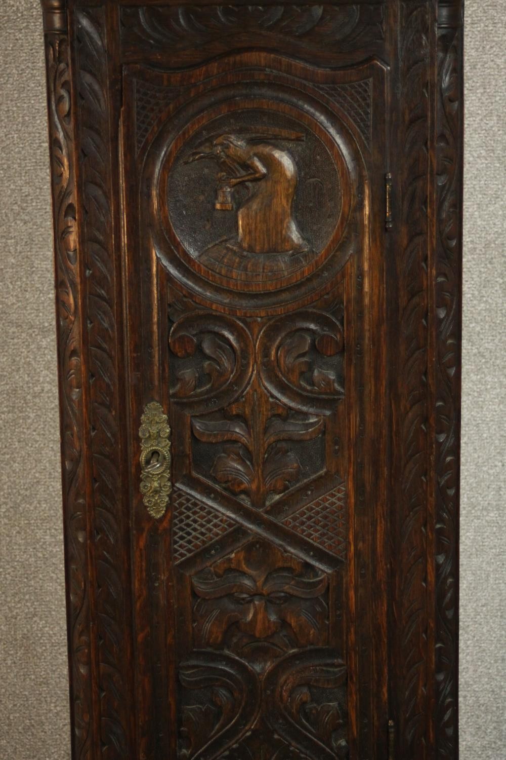 A 19th century carved oak longcase clock, the hood with a swan neck pediment and reeded columns, the - Image 11 of 13