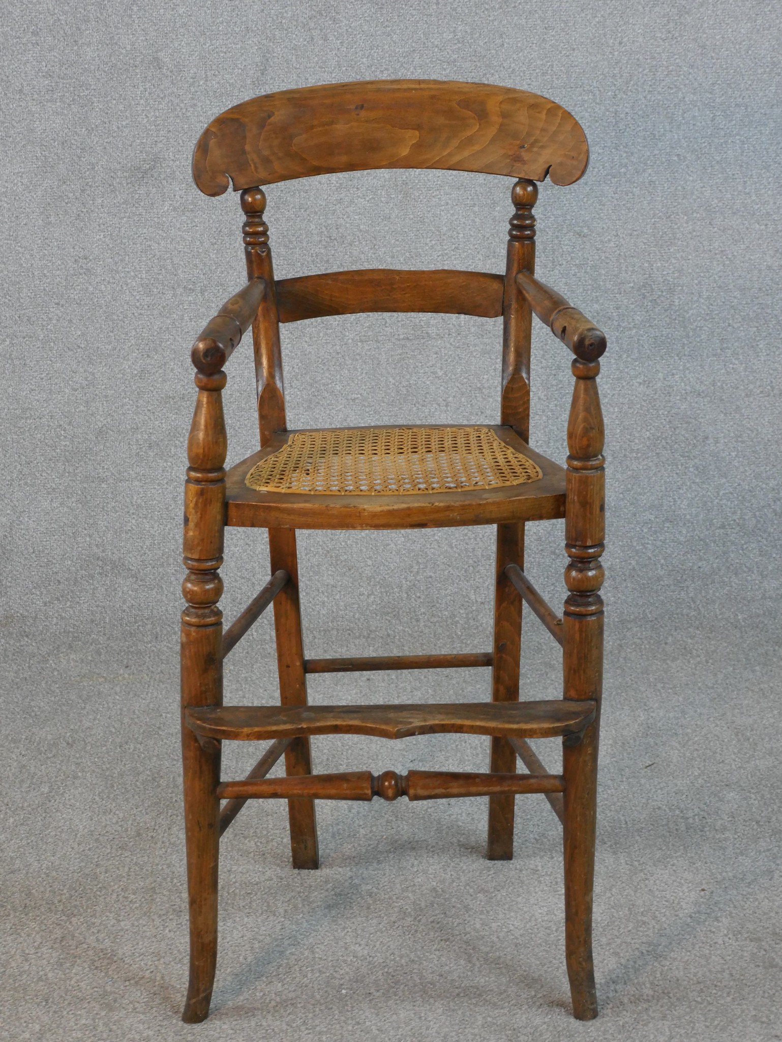 A 19th century beech child's high chair.