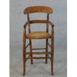 A 19th century beech child's high chair.