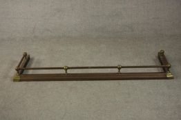 A Victorian copper fender, with brass corners and balls. L.150 D.47cm.
