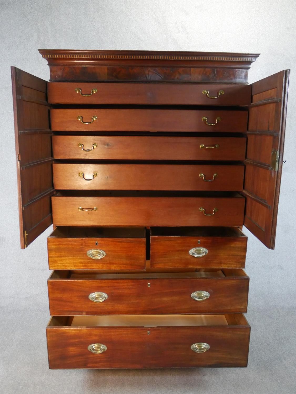 A Georgian mahogany press cupboard the upper section with flame mahogany panel doors enclosing - Image 3 of 7