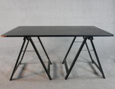 A contemporary ebonised desk, the rectangular top on two A frame supports. H.70 W.140 D.80cm