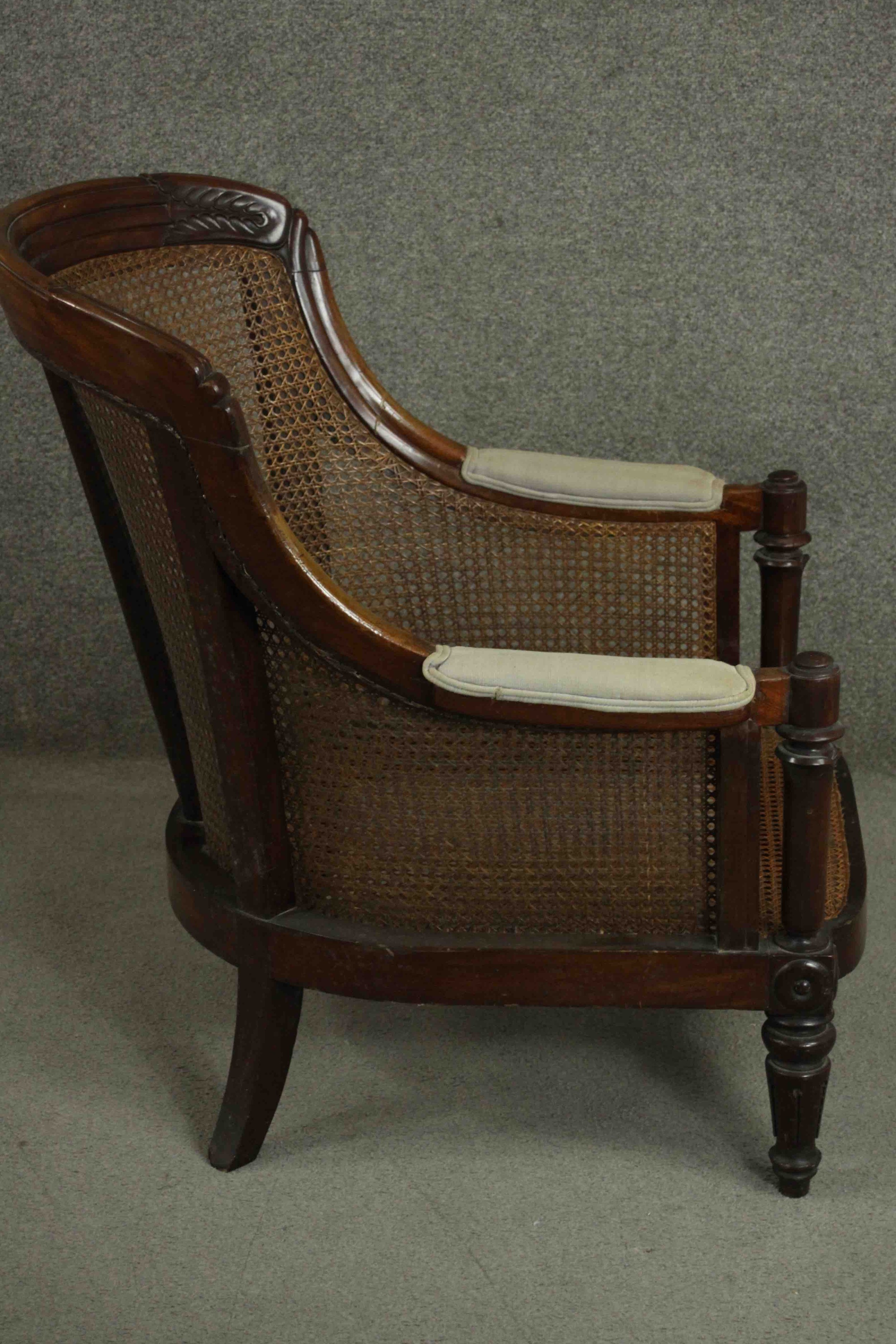 A William IV mahogany caned bergere tub chair, the reeded top rail with carved palm leaves to each - Image 4 of 8