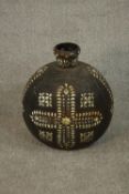 A large Indian iron water carrying bottle hand painted with a white enamel geometric design. H.42