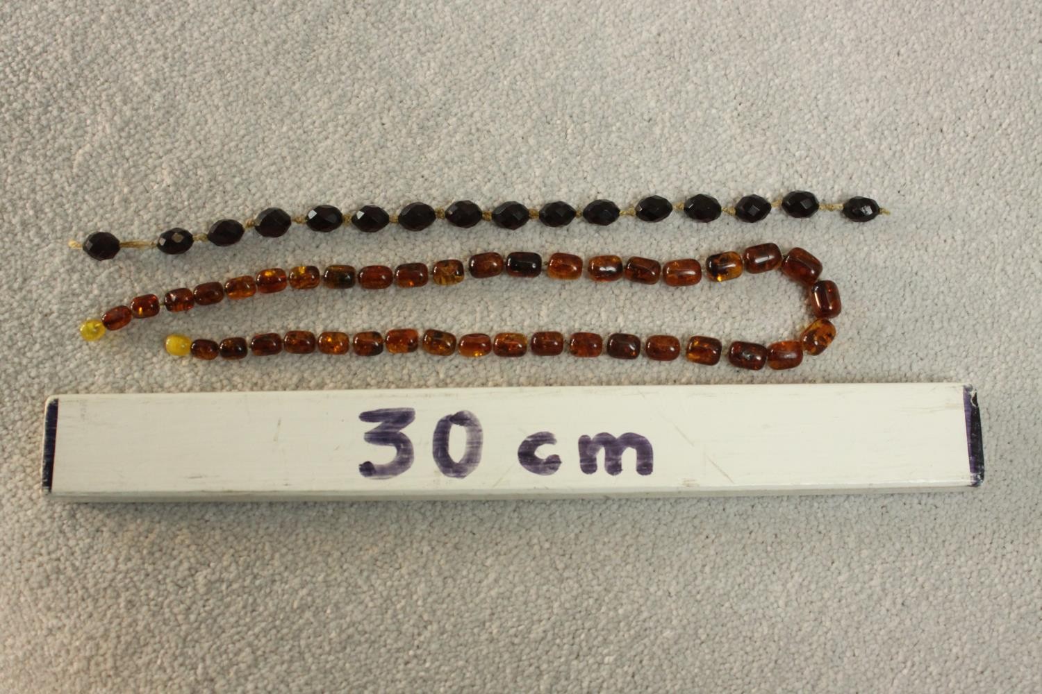 A vintage graduated Baltic amber bead necklace with a screw barrel clasp (damaged) along with a - Image 5 of 5