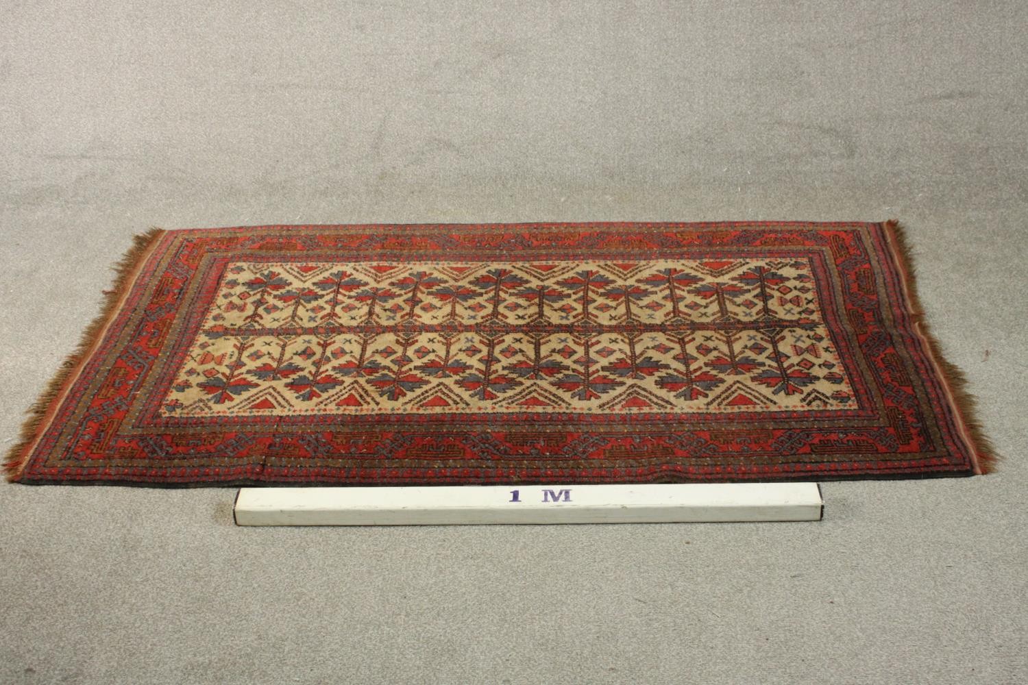 A beige ground hand made Belouch rug. L.180 W.102cm. - Image 2 of 5