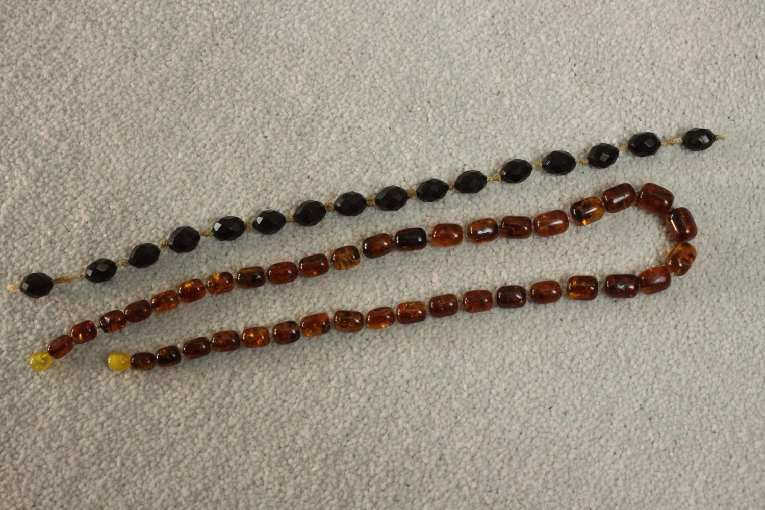 A vintage graduated Baltic amber bead necklace with a screw barrel clasp (damaged) along with a - Image 2 of 5