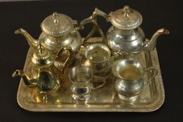 A collection of silver plate and brass, including brass pots, jugs and tray. L.37 W.26cm. (largest)