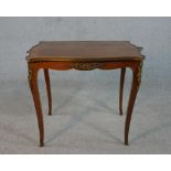 A French Louis XV style kingwood serpentine occasional table, the quarter veneered and crossbanded