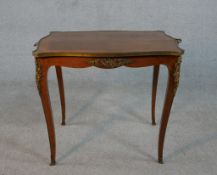 A French Louis XV style kingwood serpentine occasional table, the quarter veneered and crossbanded