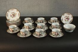 A Victoria, Czecho-Slovakia tea set, decorated with birds and flowers. H.7 Dia.13cm. (largest)