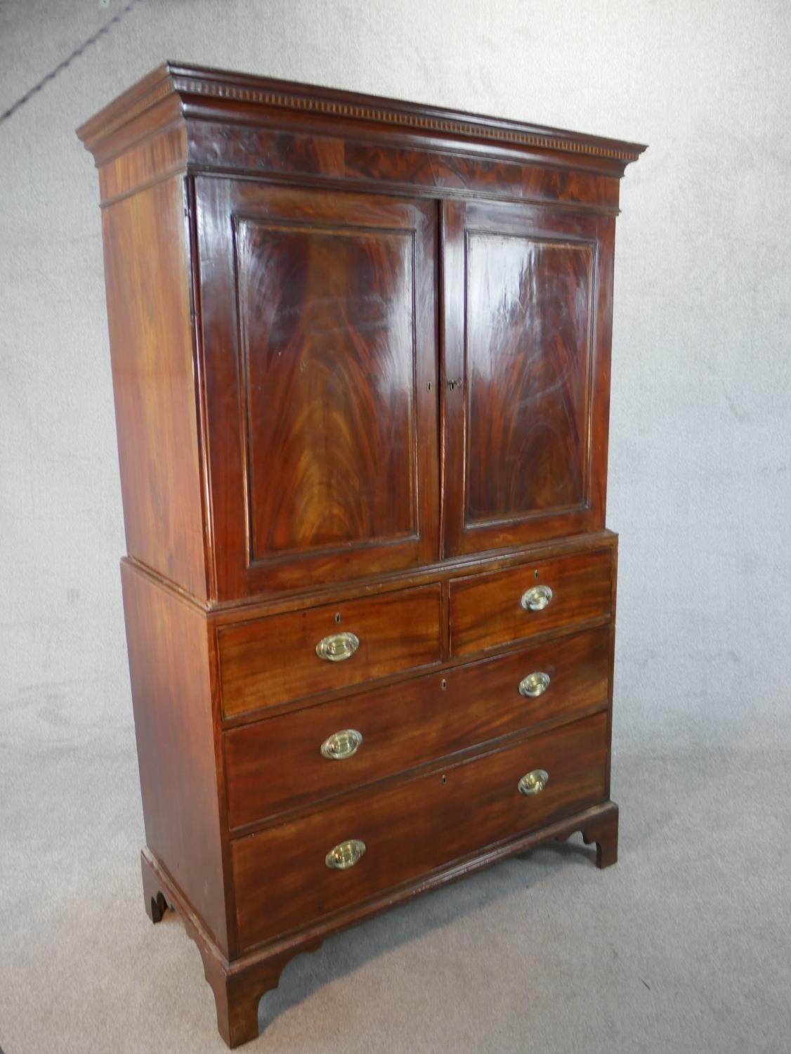 A Georgian mahogany press cupboard the upper section with flame mahogany panel doors enclosing - Image 7 of 7