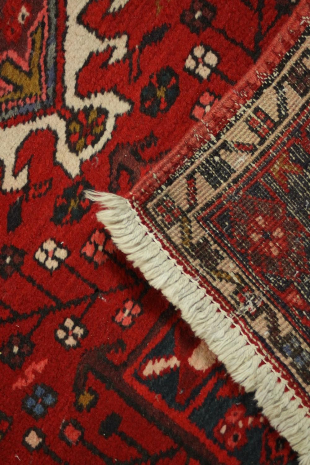 A hand made red ground Persian Heriz runner. L.440 W.100cm. - Image 5 of 5