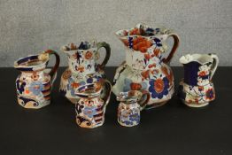 A collection of 19th century six graduated Masons Ironstone Oriental design ceramic jugs. H.25 Dia.