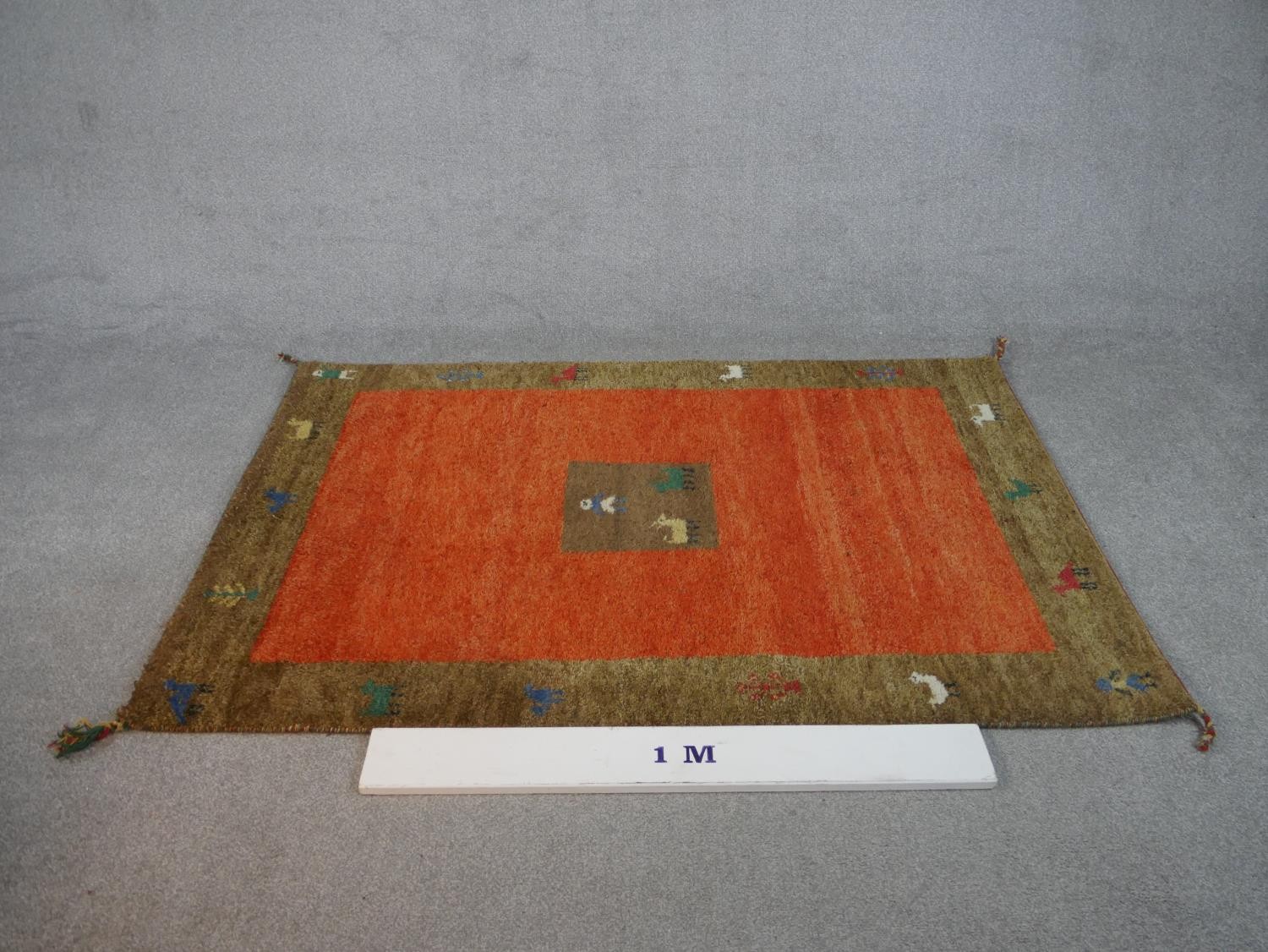 A rust ground hand made Persian Gabbeh rug. L.180 W.122cm - Image 3 of 7