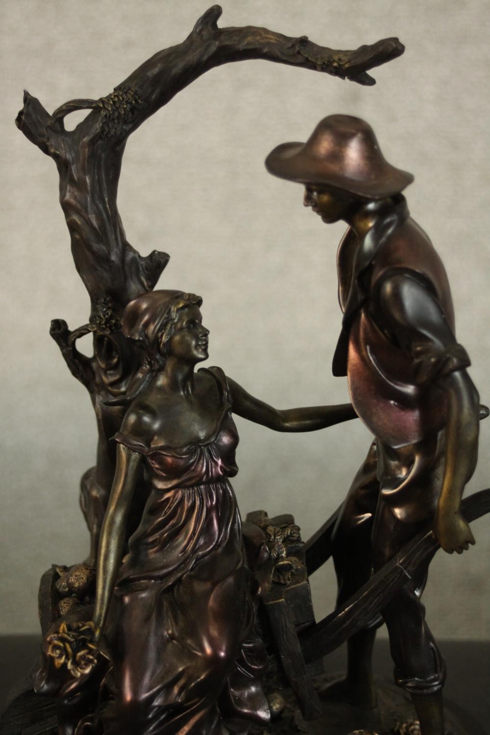 A Leonardo Collection bronze resin figure group of a young couple with a wheelbarrow under a tree. - Image 3 of 9
