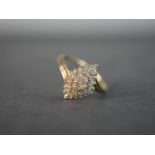 A 9 carat yellow gold and diamond cluster ring, set with thirty four round eight cut diamonds with a