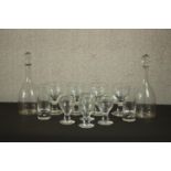 A set of four large heavy wine glasses and four smaller ones along with a pair of blown glass