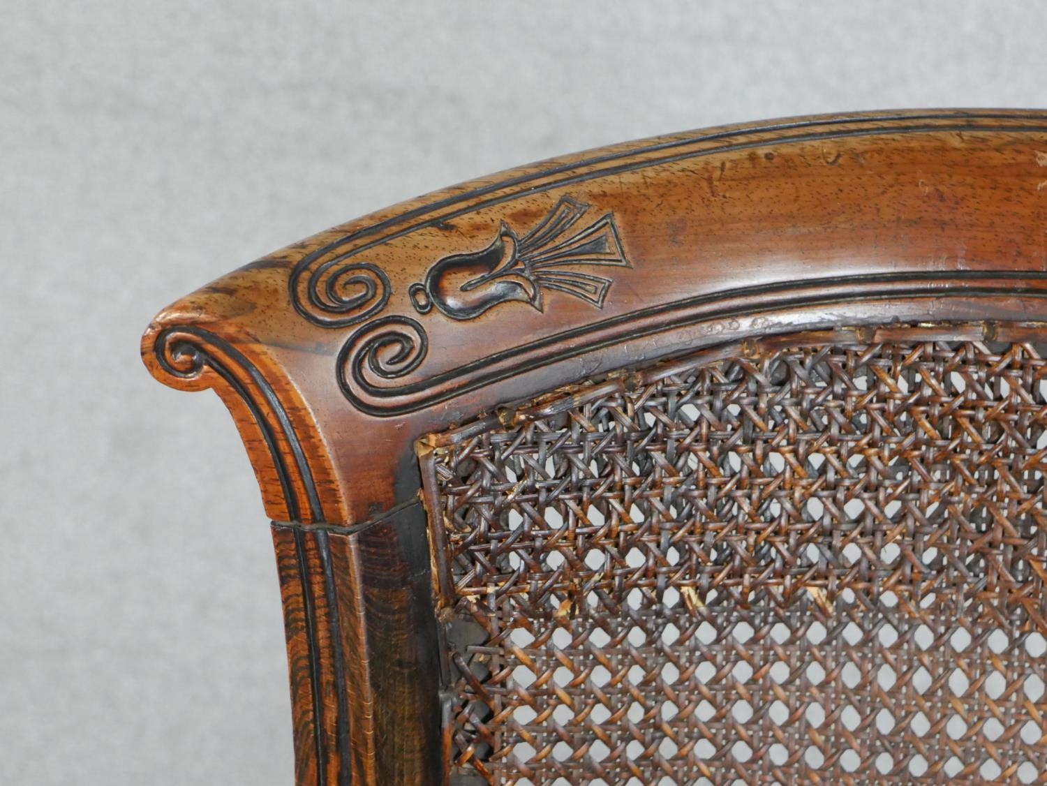 A Regency simulated rosewood bergere type side chair, the carved bar back over caning, above a red - Image 5 of 5