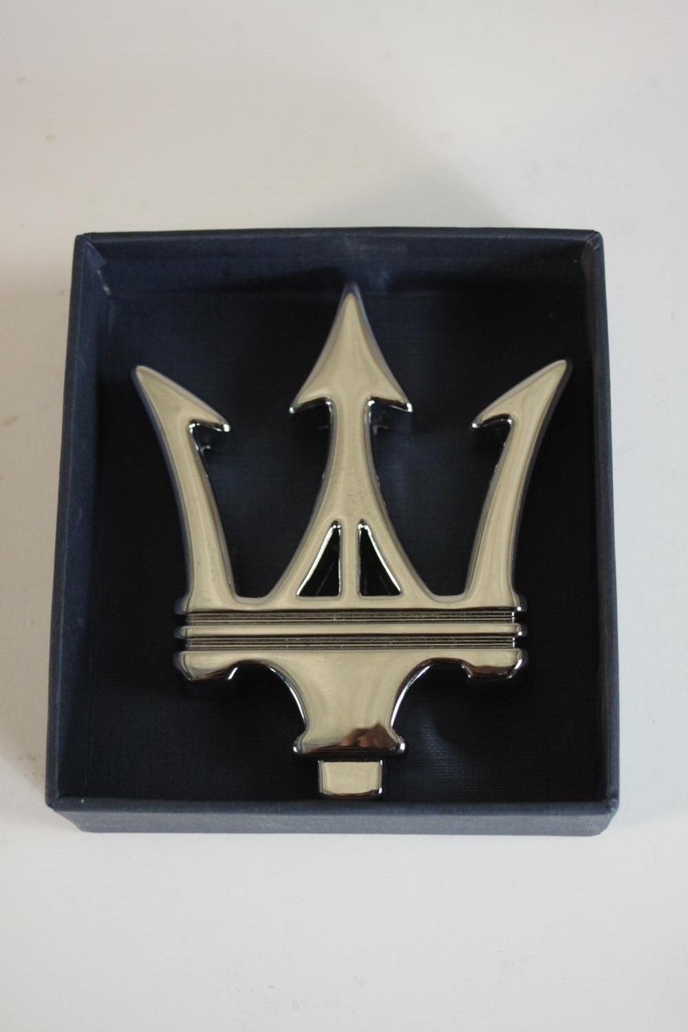 A boxed silver plated Maserati emblem paperweight. H.3 W.10 D.11.5cm. (box). - Image 2 of 5